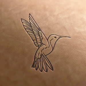 May include: A line drawing of a hummingbird with its wings spread out. The hummingbird is facing to the right and has a long beak. The drawing is on a light brown background.