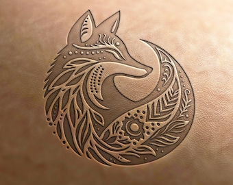May include: A detailed, intricate design of a fox with its tail curled around its body. The fox is surrounded by floral and geometric patterns, creating a circular design.