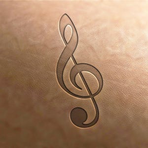 May include: A brown leather background with a black treble clef symbol embossed into the surface.