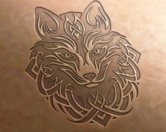 May include: A detailed line drawing of a wolf's head with intricate Celtic knotwork surrounding it. The wolf's face is stylized with a sharp nose and pointed ears.