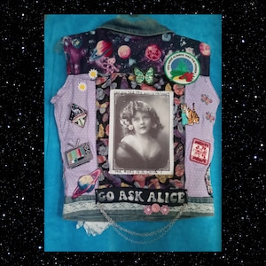 May include: A denim jacket with a variety of patches and embellishments, including a galaxy print, a butterfly, a vintage photo, and the text "Go Ask Alice".