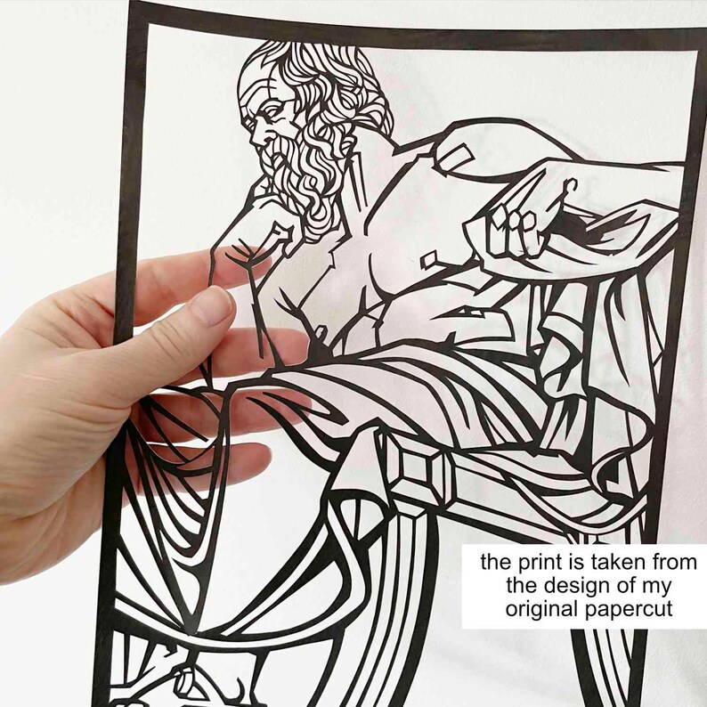 Puede incluir: Arte de papel recortado en blanco y negro de un hombre sentado en una silla. La impresi&oacute;n se toma del dise&ntilde;o de mi recorte de papel original.