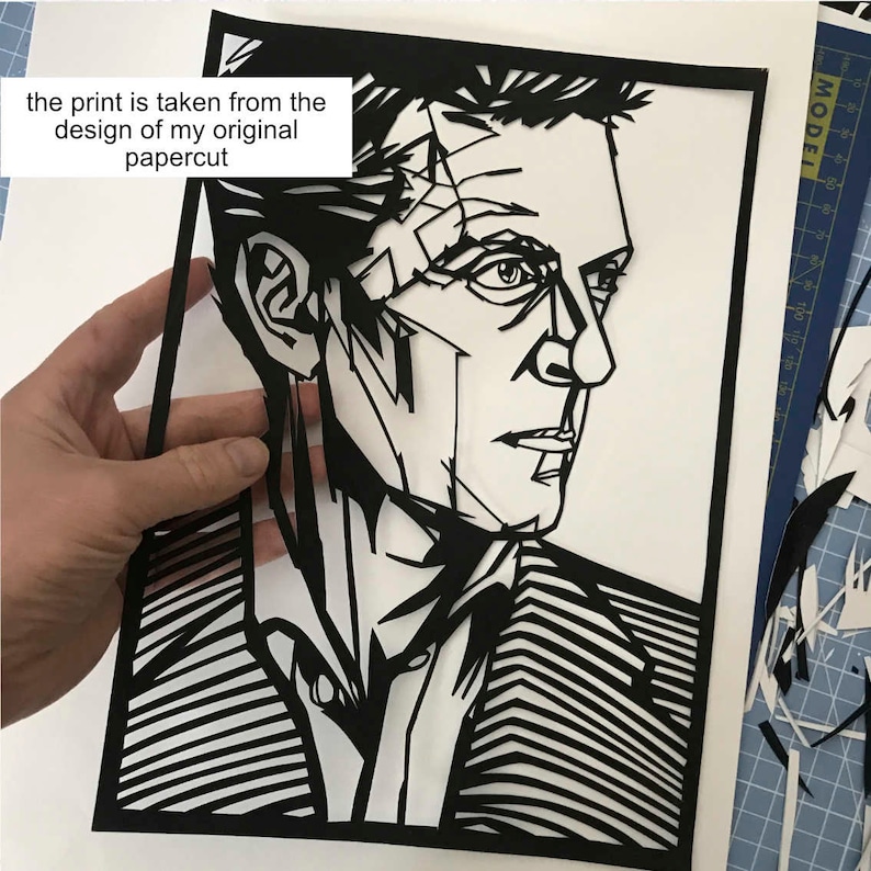 May include: Black and white papercut portrait of a man with a geometric design. The print is taken from the design of my original papercut.