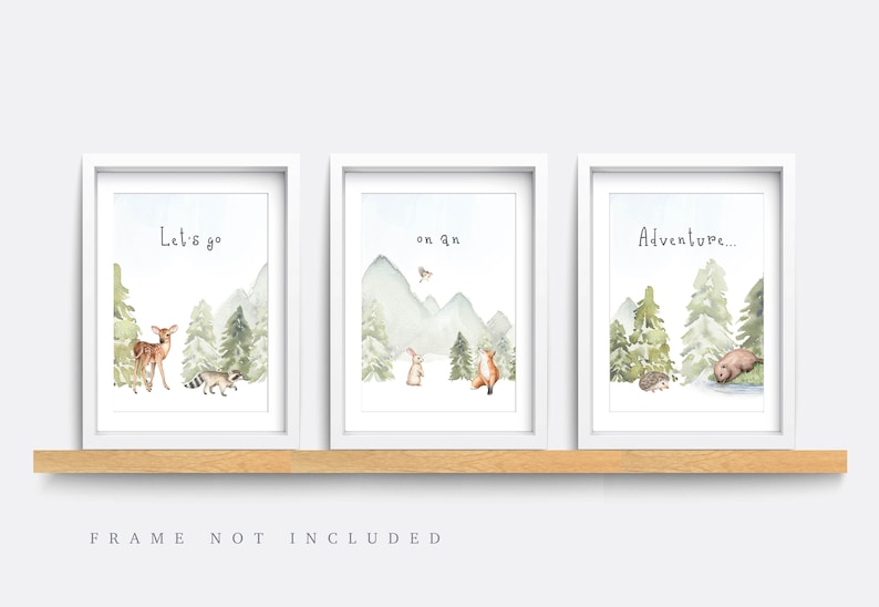May include: Three framed watercolor prints with forest scenes. Each print features a different phrase: "Let's go", "on an", and "Adventure...". The artwork includes deer, raccoon, rabbit, fox, hedgehog, and bear illustrations.