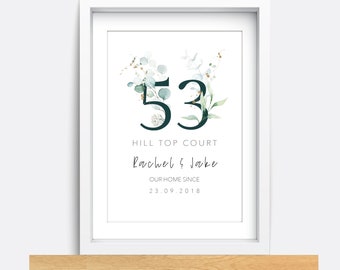 May include: A white framed print with a green and white floral design. The number 53 is in the center of the print. The text "Hill Top Court" is below the number. The text "Rachel & Jake" is below the text "Hill Top Court". The text "Our Home Since" is below the text "Rachel & Jake". The text "23.09.2018" is below the text "Our Home Since".