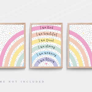 May include: Three framed prints with rainbow designs and positive affirmations. The middle print features the text "I am Kind", "I am beautiful", "I am loved", "I am strong", "I am amazing", and "I am Olivia".