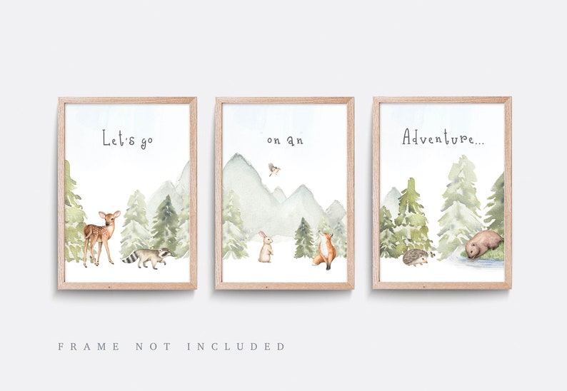 May include: Set of three framed watercolor prints with woodland animal illustrations. Each print features a different scene with a deer, raccoon, rabbit, fox, bear, and hedgehog. Text on the prints reads "Let's go", "on an", and "Adventure..."
