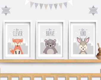 May include: Three framed prints with a gray background and white borders. Each print features a different animal: a fox, a bear, and a deer. The text on each print reads "be clever", "be brave", and "be kind".