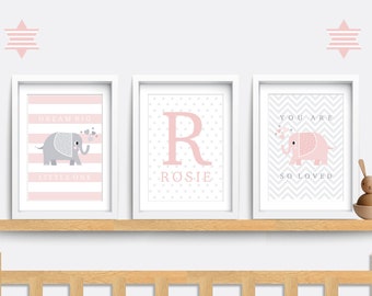 May include: Three framed prints with pink and gray stripes, polka dots, and chevron patterns. Each print features a pink elephant with gray details and the text "Dream Big Little One", "Rosie", and "You Are So Loved".