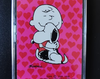 Fridge magnet ~ Genuine vintage playing card, 1980s. Charlie Brown hugging Snoopy with hearts; Peanuts Gang. Schulz. Love, Valentine, couple