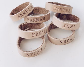 Natural vegetable tan leather custom embossed name band with solid brass closure