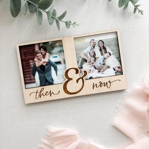 May include: A wooden photo frame with two picture slots. The left side has a photo of a couple, and the right side has a family photo. The words "then & now" are engraved on the frame in a cursive font.