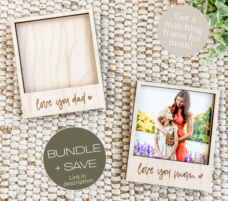 May include: Two wooden photo frames with a Polaroid style design. The frame on the left says "love you dad" and the frame on the right says "love you mom".