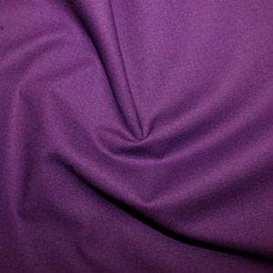 May include: A solid purple fabric swatch. The fabric has a smooth, even texture.