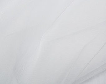 Tela de tul para velo de novia, color blanco seda. Material: 100 % nailon, red transparente, ideal para tocados, sombreros, adornos, disfraces y manualidades. Por metro.