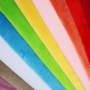 May include: A rainbow of fabric swatches in various colors, including purple, brown, light blue, blue, green, yellow, pink, orange, red, and burgundy.