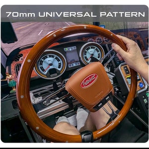 May include: Two steering wheels are shown, one black and one wood-grain, with the text "55mm MOZA PATTERN" and "70mm UNIVERSAL PATTERN". The image also shows a brown leather accessory with the text "55mm to UNIVERSAL 70 mm WHEEL ADAPTER".