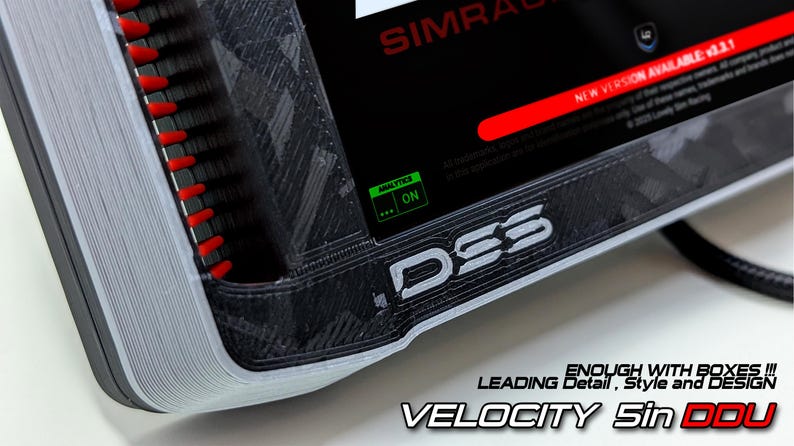 May include: A black and grey Velocity 5in DDU sim racing display unit with a textured 3D printed frame, red side accents, and a screen showing SIMRACING text, a new version notification, and an analytics on indicator. The text D5S is visible.