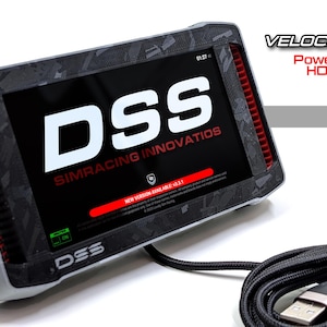 May include: A Velocity 5in DDU sim racing dashboard display with a black and gray patterned frame. The screen shows the text DSS SIMRACING INNOVATIOS and NEW VERSION AVAILABLE. Includes a black braided USB cable with a standard connector.