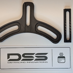 May include: Two black 3D printed parts for a racing simulator. The larger part is a Y-shaped bracket with two curved slots. The smaller part is a straight piece with a slot. The parts are labelled "DSS SIM RACING INNOVATIONS" and "PRACTICE RACE WIN".