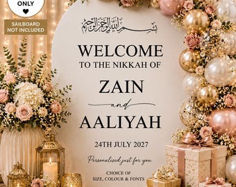 May include: A white arched sign featuring black text that reads: Welcome to the Nikkah of Zain and Aaliyah, 24th July 2027. The sign is decorated with a large balloon arch in shades of gold, rose gold, and white, alongside floral arrangements and lanterns.