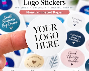 May include: A sheet of circular non-laminated paper stickers featuring various designs, including a white sticker with the black text YOUR LOGO HERE, dark blue stickers with the text Small Business Big Dreams, and pink stickers with the text Good Things Inside.