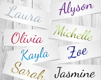 May include: Eight white paper cards with different names written in colourful script. The names are: Laura, Olivia, Kayla, Sarah, Alyson, Michelle, Zoe, and Jasmine.