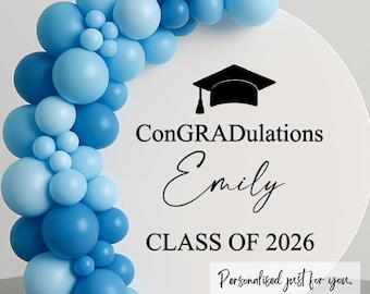 May include: A graduation design with a white circular background, the text reads "ConGRADulations Emily CLASS OF 2026". A cluster of blue balloons frames the left side. The design includes a graduation cap graphic and the text "Personalised just for you."