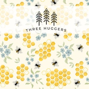 May include: A repeating pattern featuring yellow honeycomb shapes, blue flowers, green leaves, and black and yellow bees on a cream background. The text "THREE HUGGERS" is centered at the top. The design is whimsical and nature-themed.