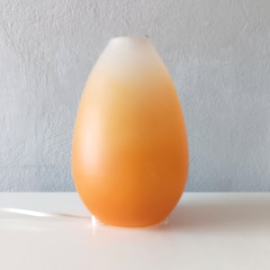 Vintage orange glass egg lamp from the year 2000 made by Massive Belgium.