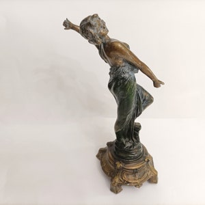 Vintage art deco metal figure of woman in green dress circa 1940s metal statue of art deco flapper on metal base