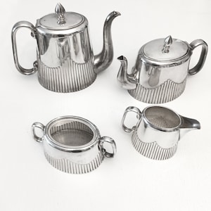 Antique art deco tea and coffee set circa 1920 silver plated teapot sugar and creamer coffee pot