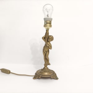 Antique  Art nouveau ornate bronze table lamp with cherub figure circa 1930 Modernist bronze lamp with putti from Spain