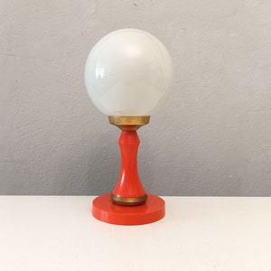 Orange and brass Pop era table lamp with white opaline globe circa 1960 small side table lamp with glass globe from Spain