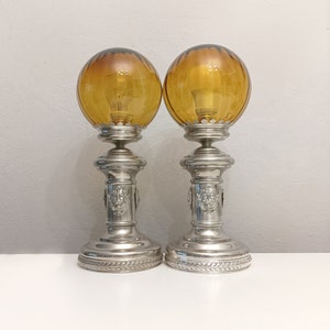 Antique pair of table lamps with amber globes circa 1920 large silver plated lamps with lion faces