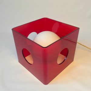 Red plexiglas cube side table lamp with a white globe circa 1990 red cubic lamp