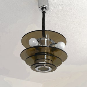 Mcm Space Age chrome and clear brown smoked glass pendant light from the 1970s Bauhaus glass ceiling light