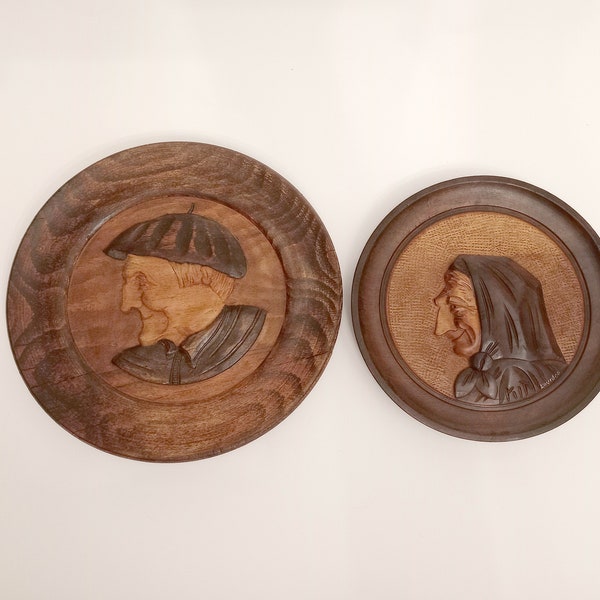 Vintage hand carved wooden plates of an elderly couple Northern Spain circa 1970 wooden plates featuring a man and a woman wall plate