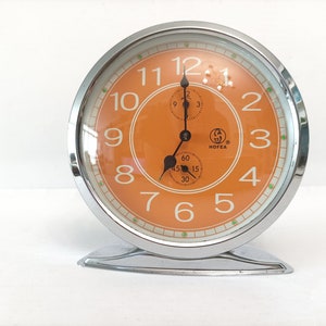 Vintage orange space age alarm clock from Hofea circa 1970 retro chrome table clock