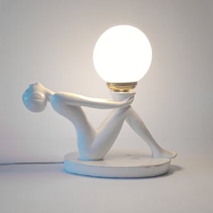 White Art Deco style table lamp from the 1970s large ceramic table lamp with art deco lady and white opaline globe