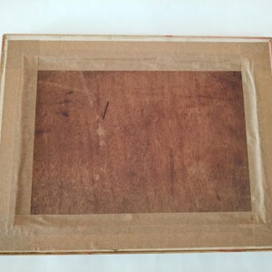 May include: A wooden picture frame with a brown wood finish and a gold trim. The frame is empty and ready for a picture.