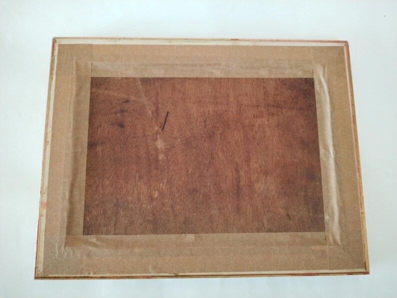 May include: A wooden picture frame with a brown wood finish and a gold trim. The frame is empty and ready for a picture.
