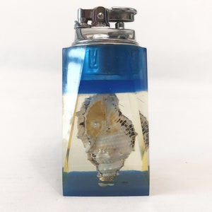 Kitsch blue lucite penguin table lighter with shell and pearl circa 1960 retro aquarium blue and clear lucite lighter
