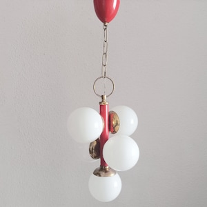 Atomic Space age Sputnik gold brass and red pendant light with five white opaline glass globes circa 1960 Ceiling light with glass shades