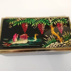 Vintage zwarte sieradendoos met vogels en boom gemaakt in Japan circa 1970 zwarte muziekdoos Liefdesverhaalthema