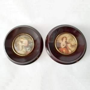 Antique round miniature pictures with religious images from around the 1940 set of two miniatures with wooden frames and convex glass