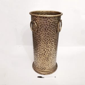 Brutalist umbrella stand with three round handles from Spain circa 1960 Gold hammered metal and iron mcm cane or walking stick stand