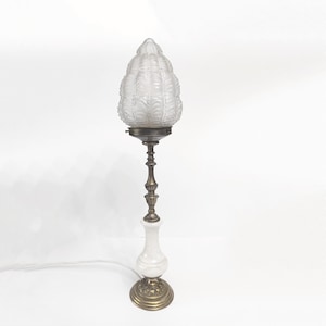 Antique ornate bronze and alabaster table lamp with frosted flame shape shade from France circa 1920