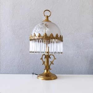 Mcm ornate bronze and brass table lamp with long glass tassel rim from the 70s retro table lamp with frosted shade