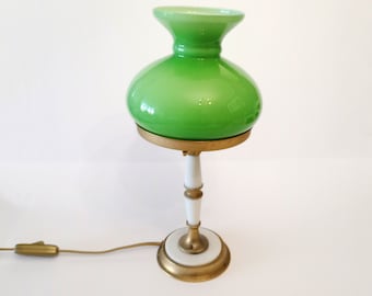 Mid Century table lamp with white plastic and gold metal base and structure and an apple green opaline shade from the 1950s.